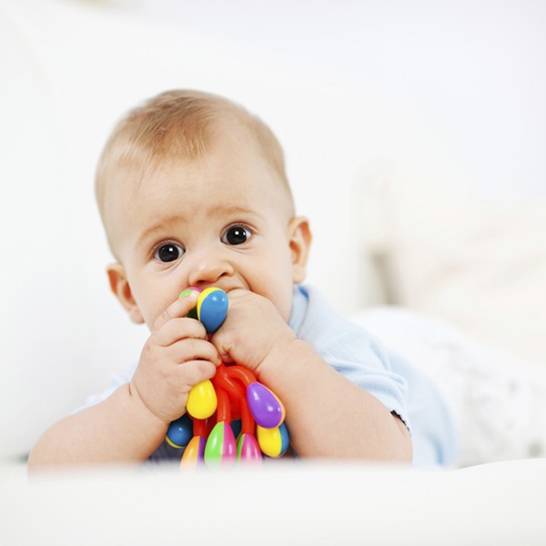 Little baby boy lying on the sofa with the toy in his mouth. 

[url=https://www.istockphoto.com/search/lightbox/9786682][img]https://dl.dropbox.com/u/40117171/children5.jpg[/img][/url]
