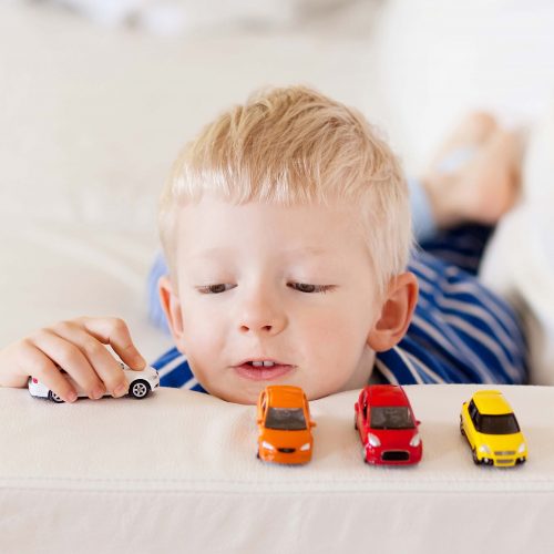 Boy Playing with Toy Cars